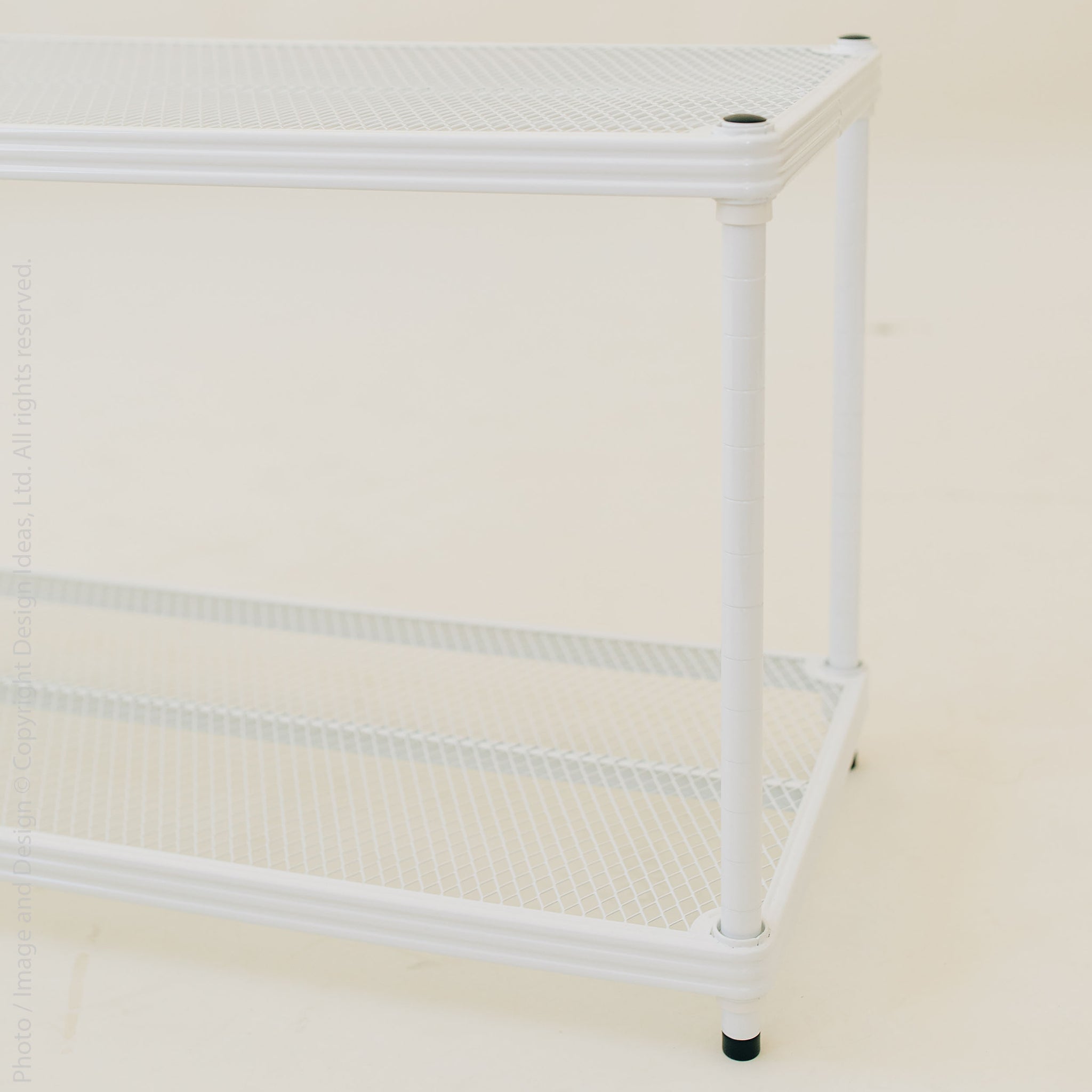Close-up of shelf corner with feet and base