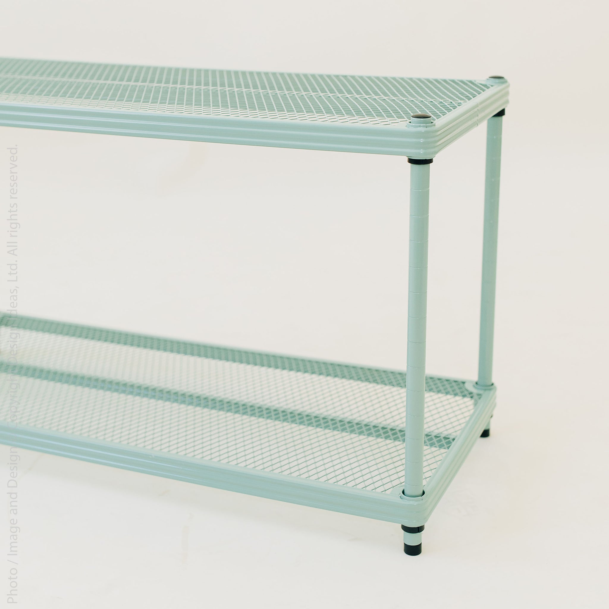 Close-up of mint green shelf surface